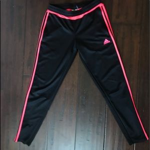 Black and coral adidas joggers